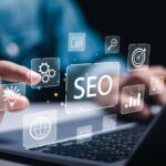 Businessman use laptop to analyze SEO search engine optimization for promoting ranking traffic on website and optimizing your website to rank in search engines