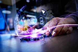 Digital marketing media (website ad, email, social network, SEO, video, mobile app) in virtual globe shape diagram. Waves of blue light and businessman using on smartphone as concept